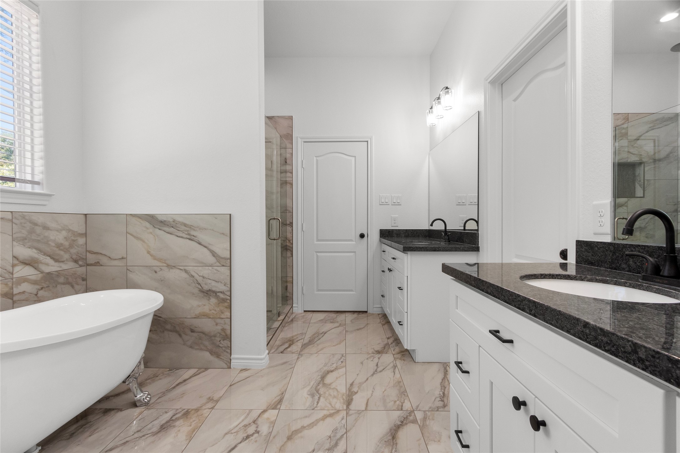 16735 Azalea Lane Plantersville, TX 77363 - Photo 21 of 44 a bathroom with a granite countertop sink mirror vanity and toilet