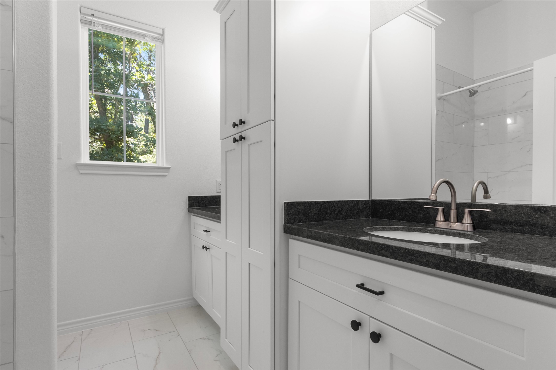 16735 Azalea Lane Plantersville, TX 77363 - Photo 26 of 44 a bathroom with a granite countertop sink and a mirror