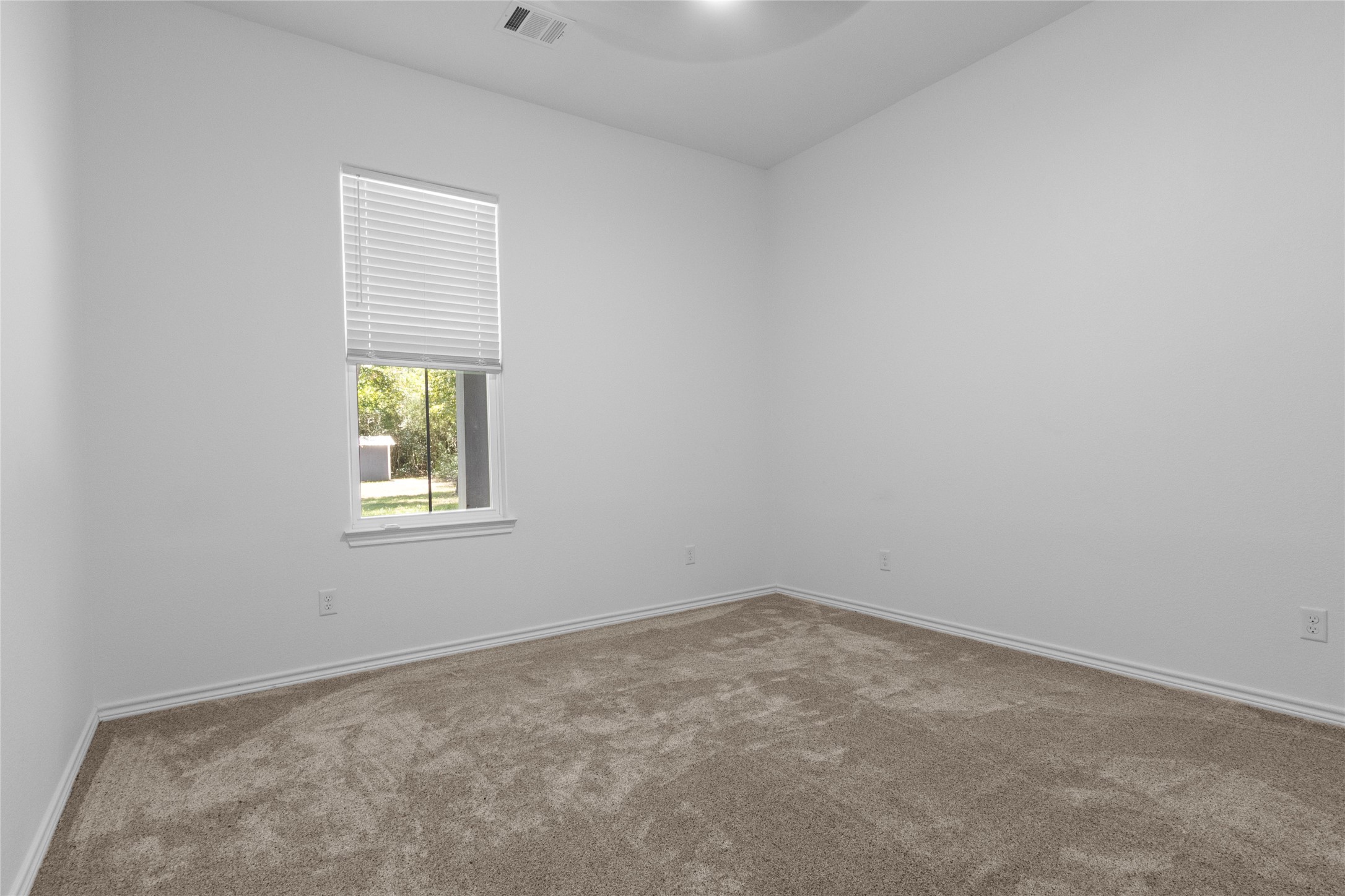 16735 Azalea Lane Plantersville, TX 77363 - Photo 27 of 44 an empty room with a window