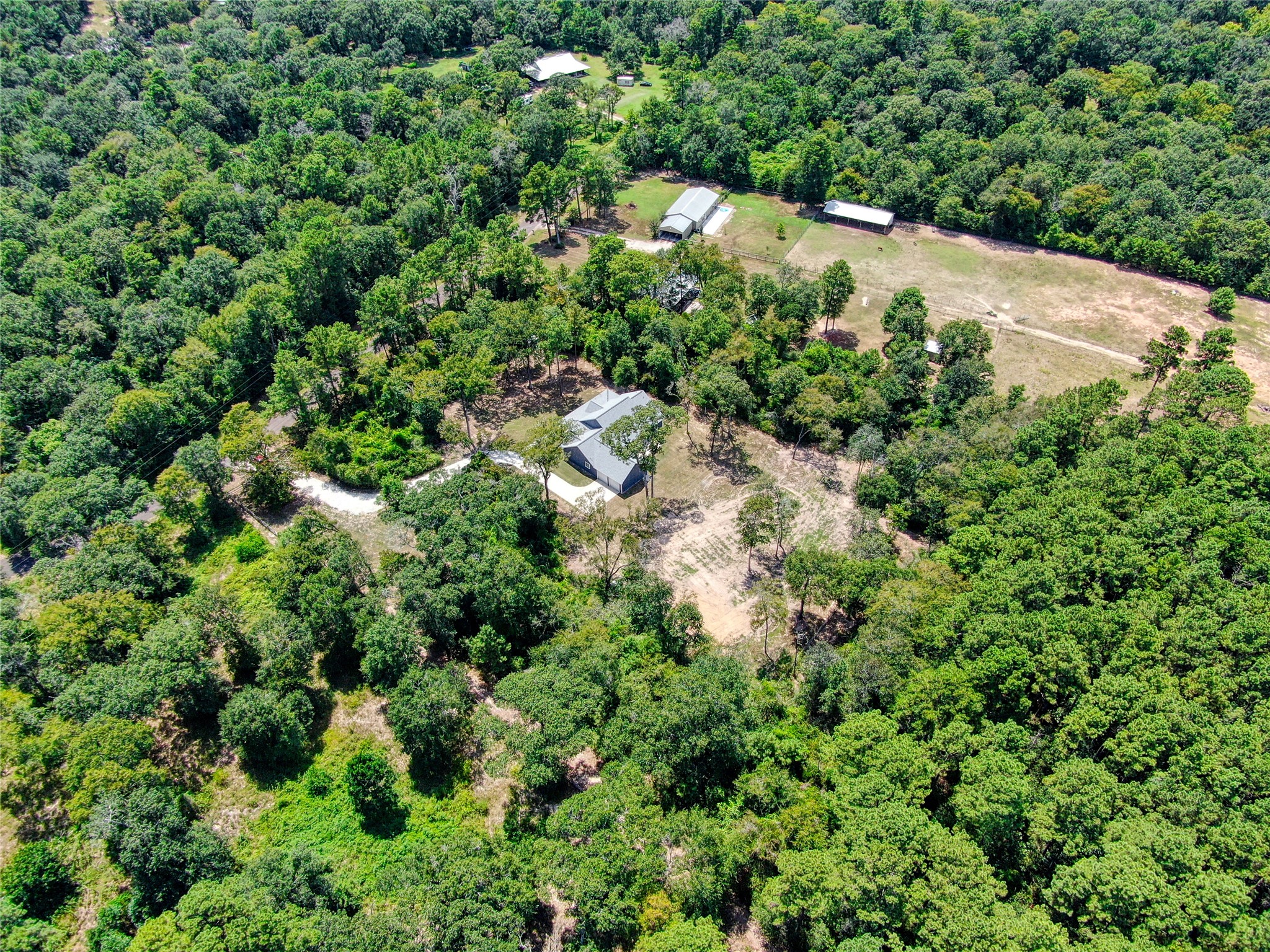 16735 Azalea Lane Plantersville, TX 77363 - Photo 36 of 44 an aerial view of residential house with outdoor space and trees all around