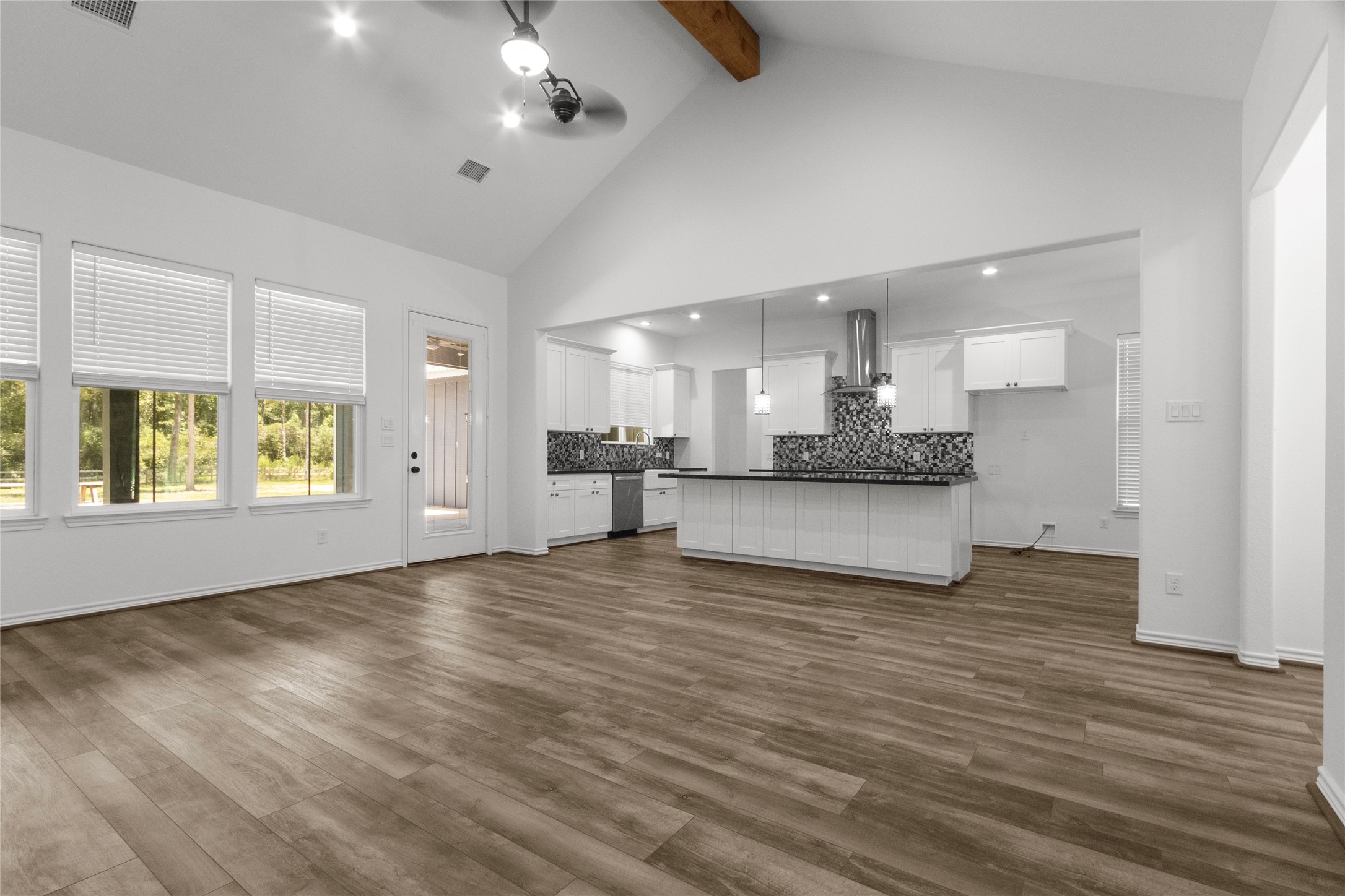 16735 Azalea Lane Plantersville, TX 77363 - Photo 6 of 44 a view of an empty room with window and wooden floor