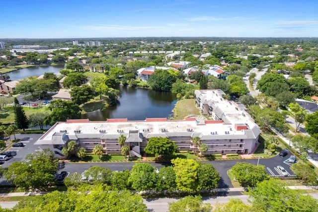 an aerial view of a house with a lake view