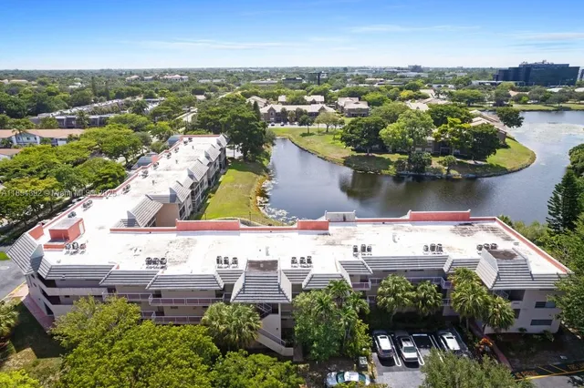 an aerial view of a house with a lake view