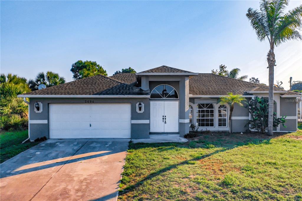 2694 Colorade Avenue North Port, FL 34286 - Photo 1 of 1 a front view of a house with a yard