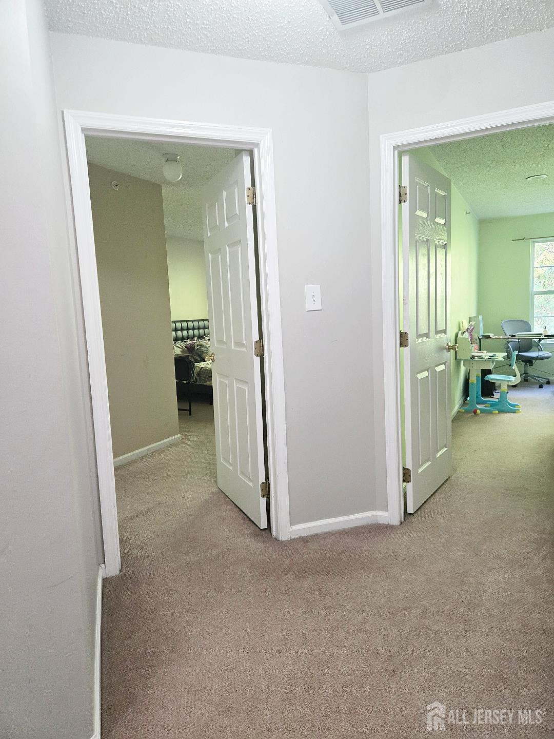 201 Prestwick Way Edison, NJ 08820 - Photo 12 of 21 an empty room with furniture and a natural light