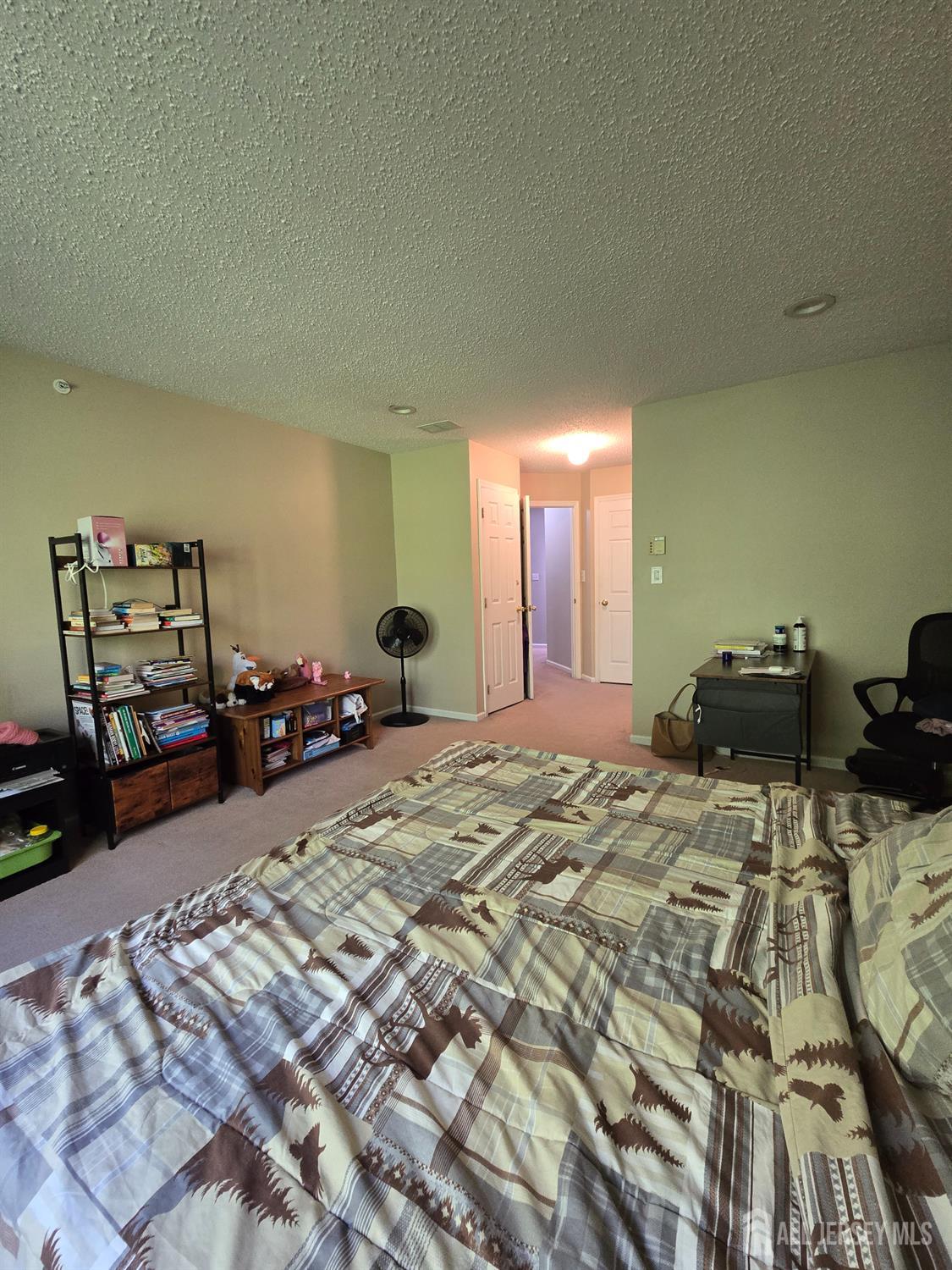 201 Prestwick Way Edison, NJ 08820 - Photo 15 of 21 a bed room with a bed and a tv