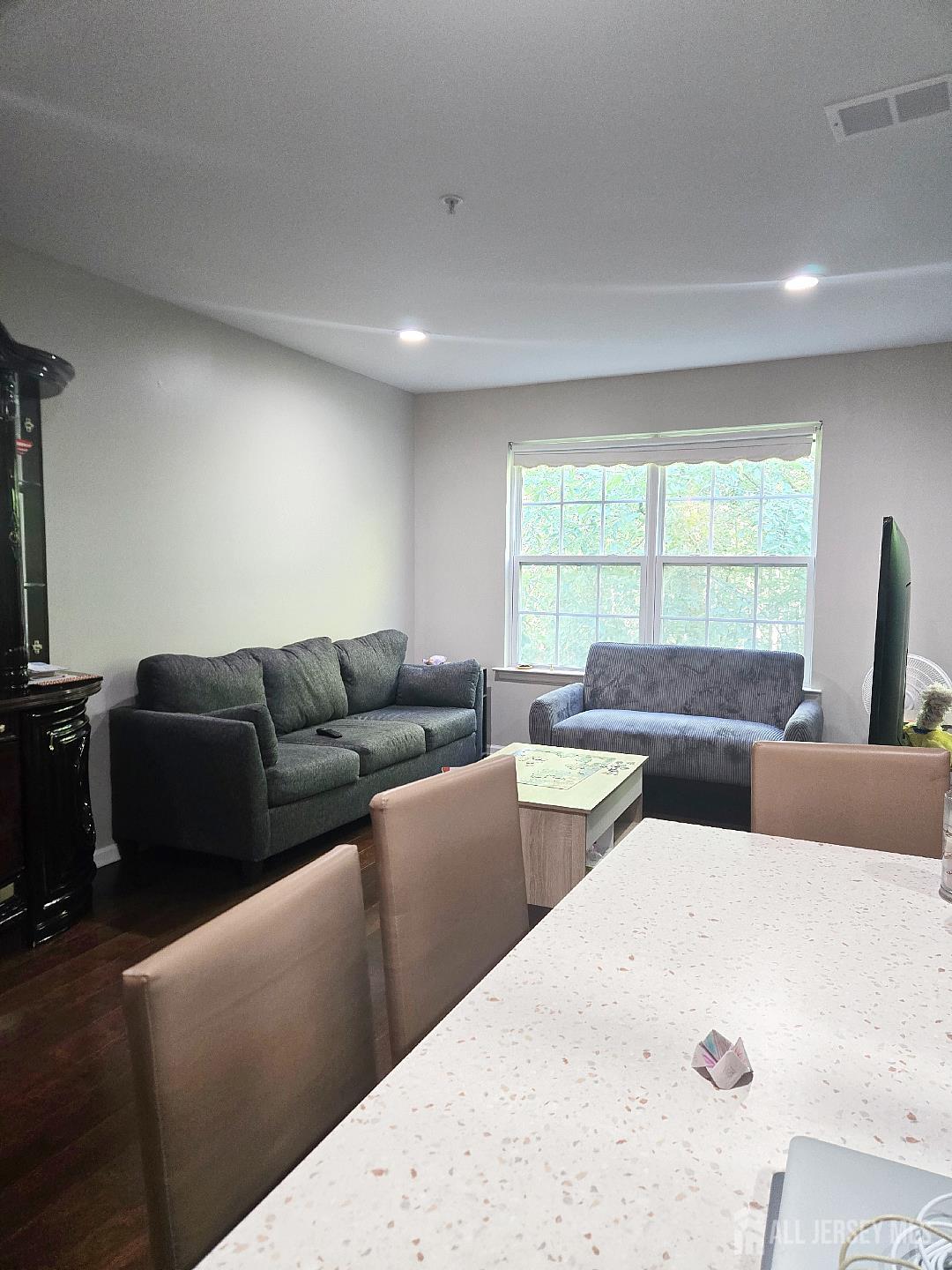 201 Prestwick Way Edison, NJ 08820 - Photo 17 of 21 a living room with furniture and windows