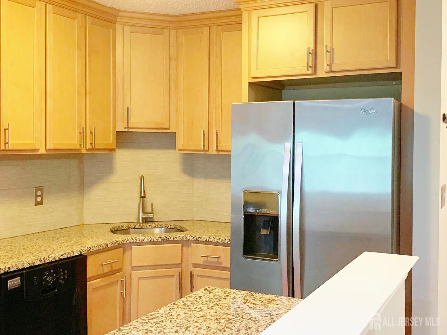 201 Prestwick Way Edison, NJ 08820 - Photo 4 of 21 a kitchen with a refrigerator and a sink