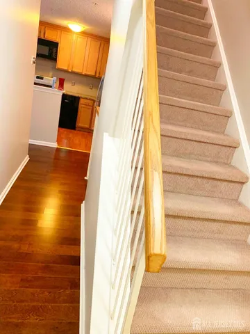 a view of entryway and kitchen