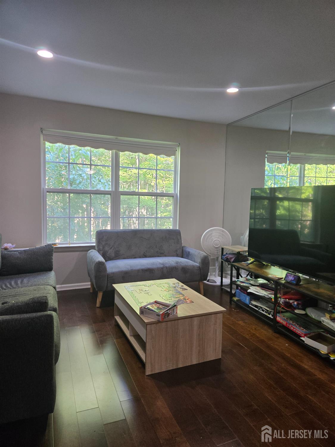 201 Prestwick Way Edison, NJ 08820 - Photo 9 of 21 a living room with furniture and a flat screen tv