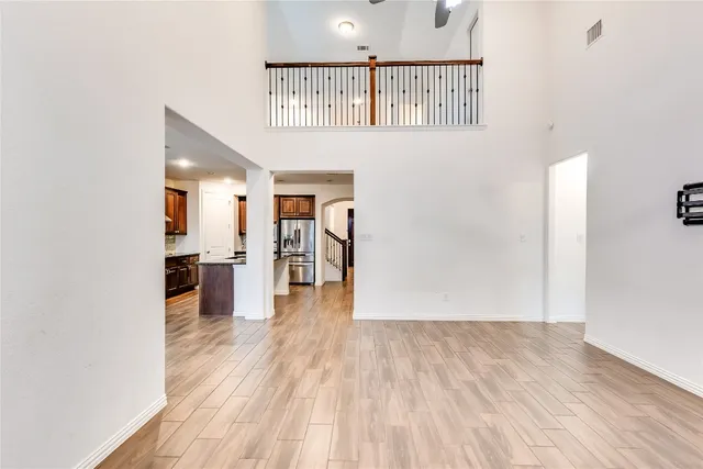 a view of a living room with wooden floor