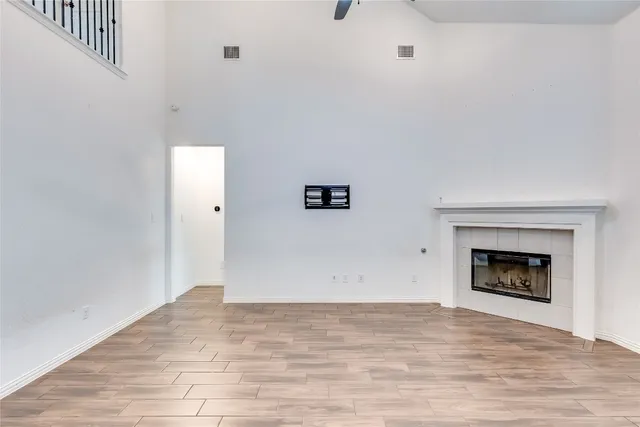a view of an empty room with fire place