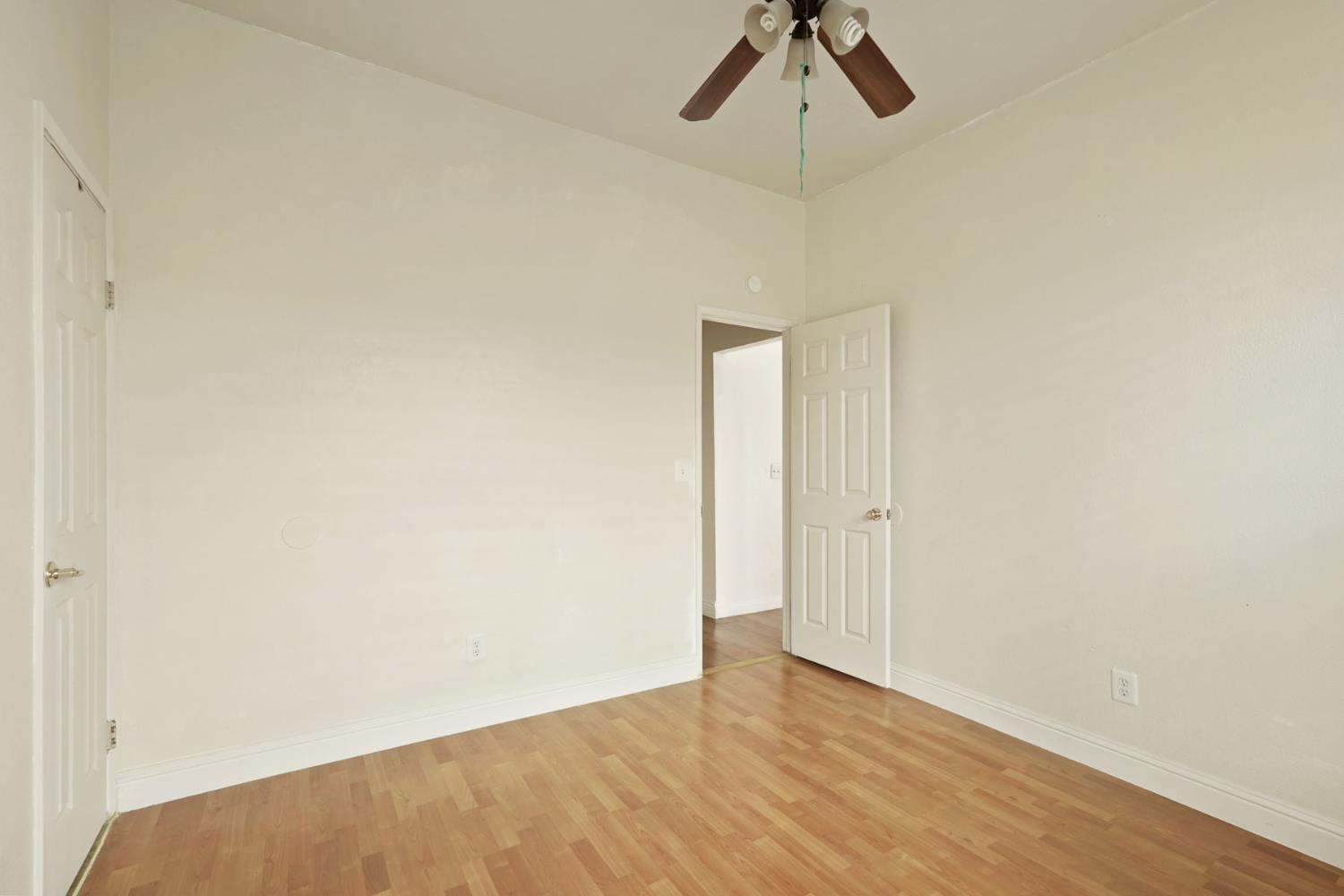 715 North Sutter Street Stockton, CA 95202 - Photo 14 of 51 a view of a room with wooden floor and ceiling fan