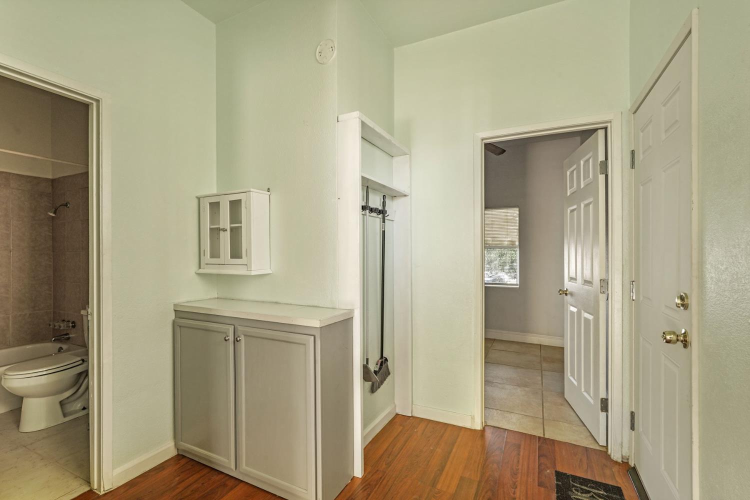 715 North Sutter Street Stockton, CA 95202 - Photo 15 of 51 a view of bathroom with a toilet a sink and a mirror