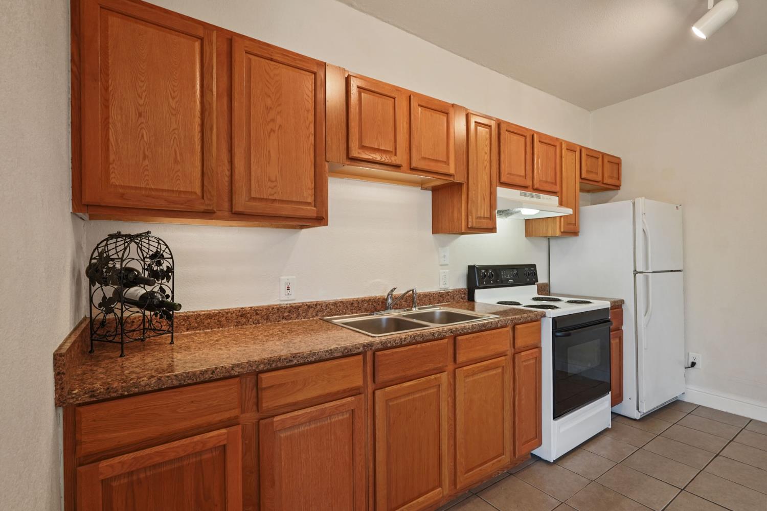 715 North Sutter Street Stockton, CA 95202 - Photo 23 of 51 a kitchen with stainless steel appliances granite countertop a sink stove and cabinets
