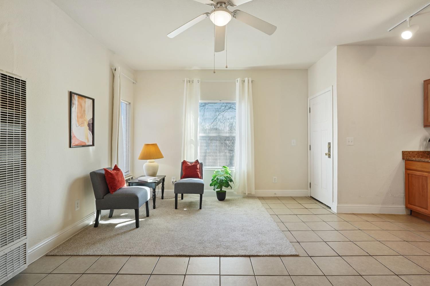 715 North Sutter Street Stockton, CA 95202 - Photo 25 of 51 a living room with furniture and a chandelier