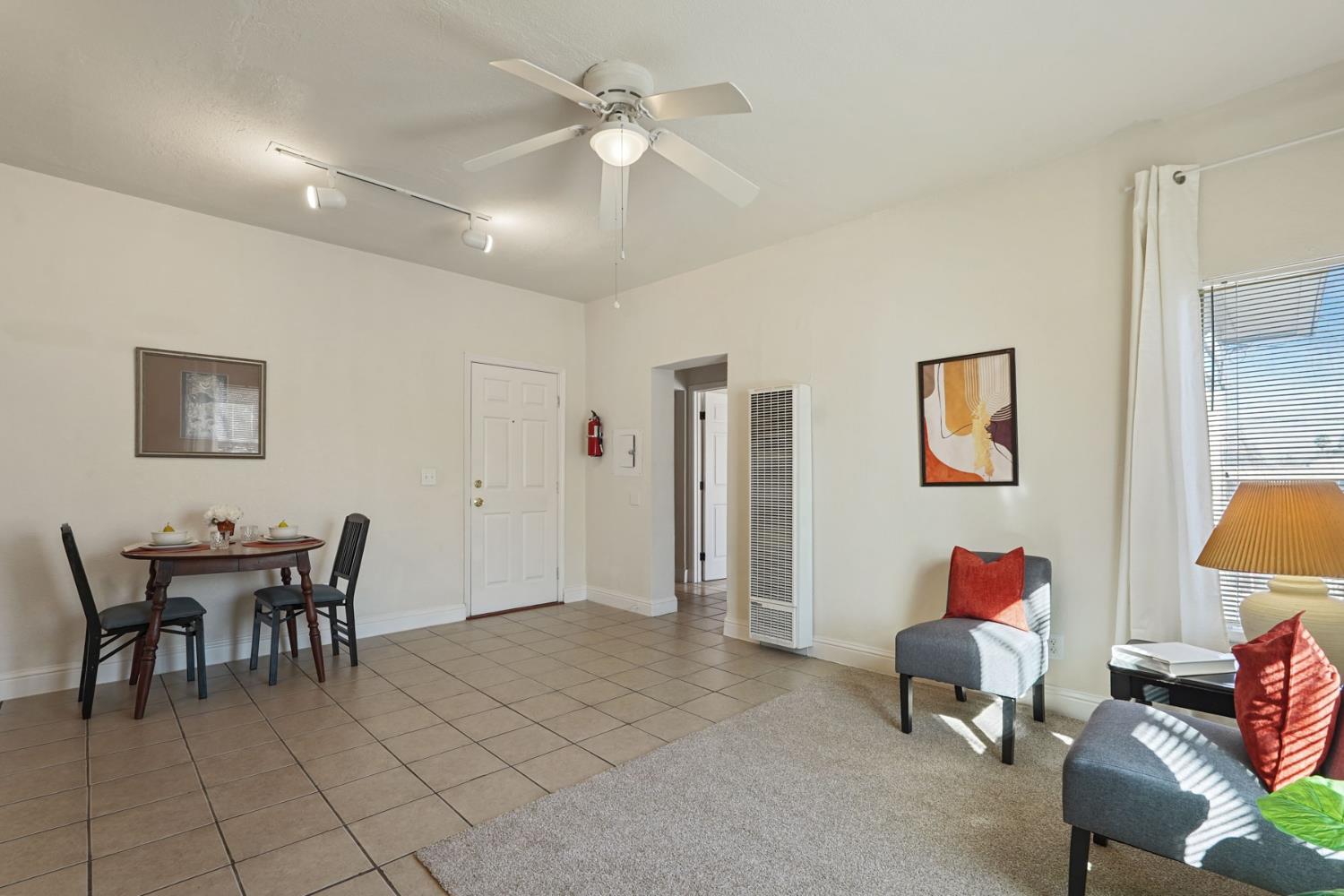 715 North Sutter Street Stockton, CA 95202 - Photo 26 of 51 a dining room with furniture and a chandelier