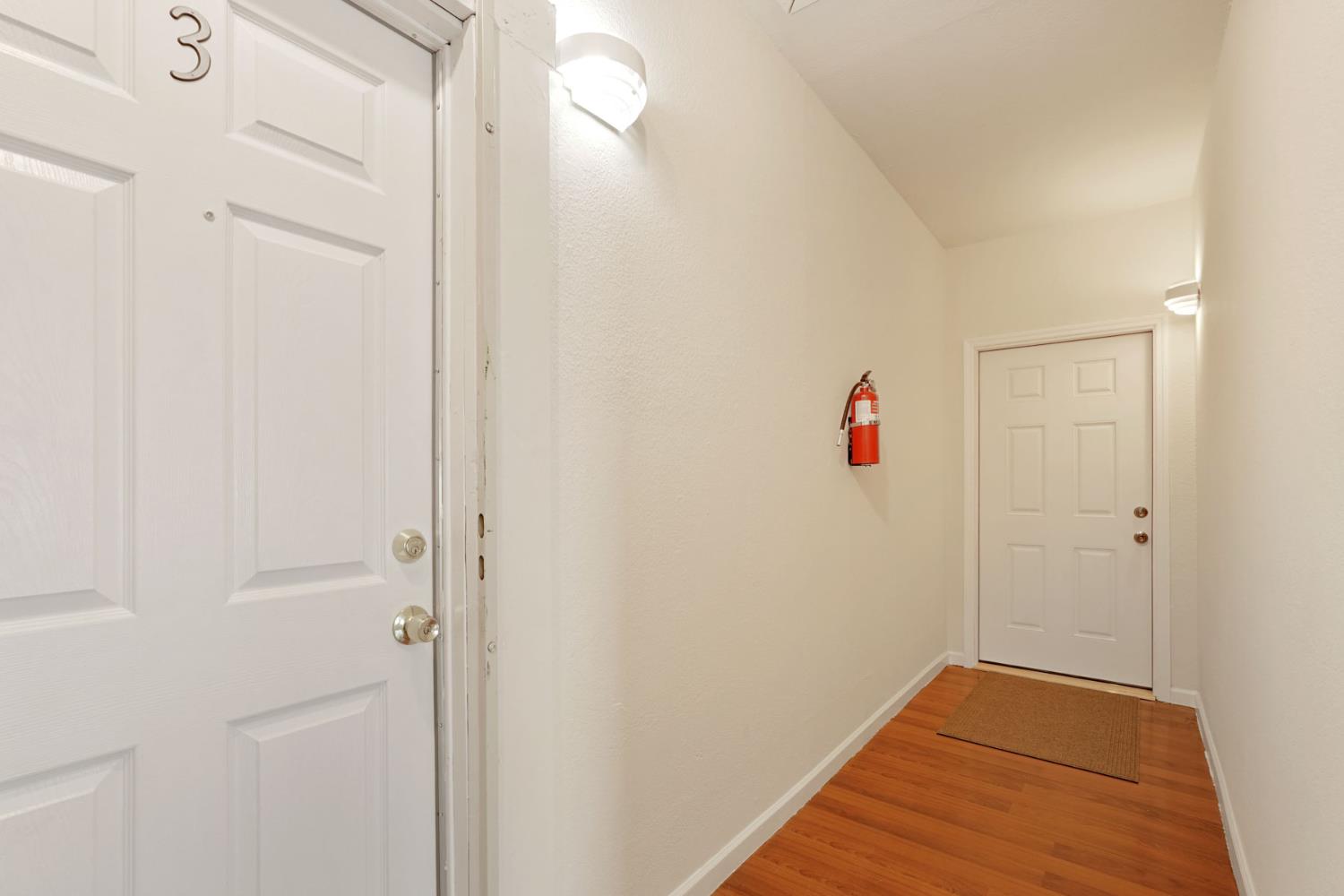 715 North Sutter Street Stockton, CA 95202 - Photo 34 of 51 a view of a hallway with wooden floor