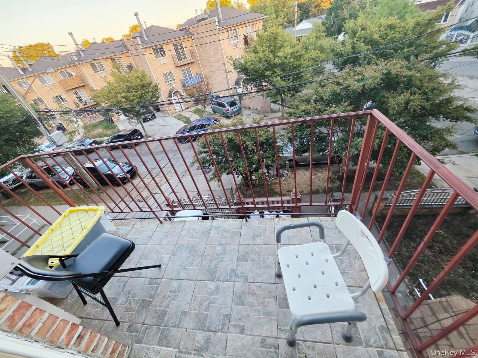 93-26 197th Street, Unit 3 Queens, NY 11423 - Photo 9 of 9 a view of balcony with wooden floor and seating space