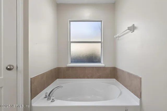 a bathroom with a bathtub