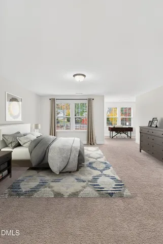 a bedroom with bed and window