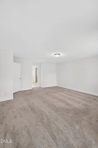 a bathroom with a shower sink and mirror