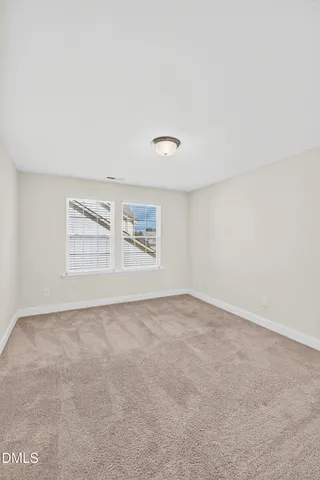 a kitchen with granite countertop a stove top oven and cabinets