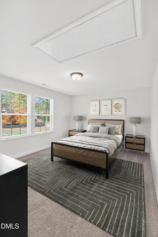 a living room with furniture and next to a window