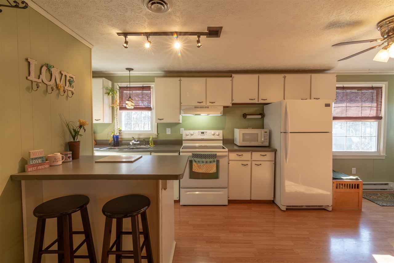 3391 Oak Ridge Road Mount Crawford, VA 22841 - Photo 3 of 27 a kitchen with refrigerator cabinets and wooden floor