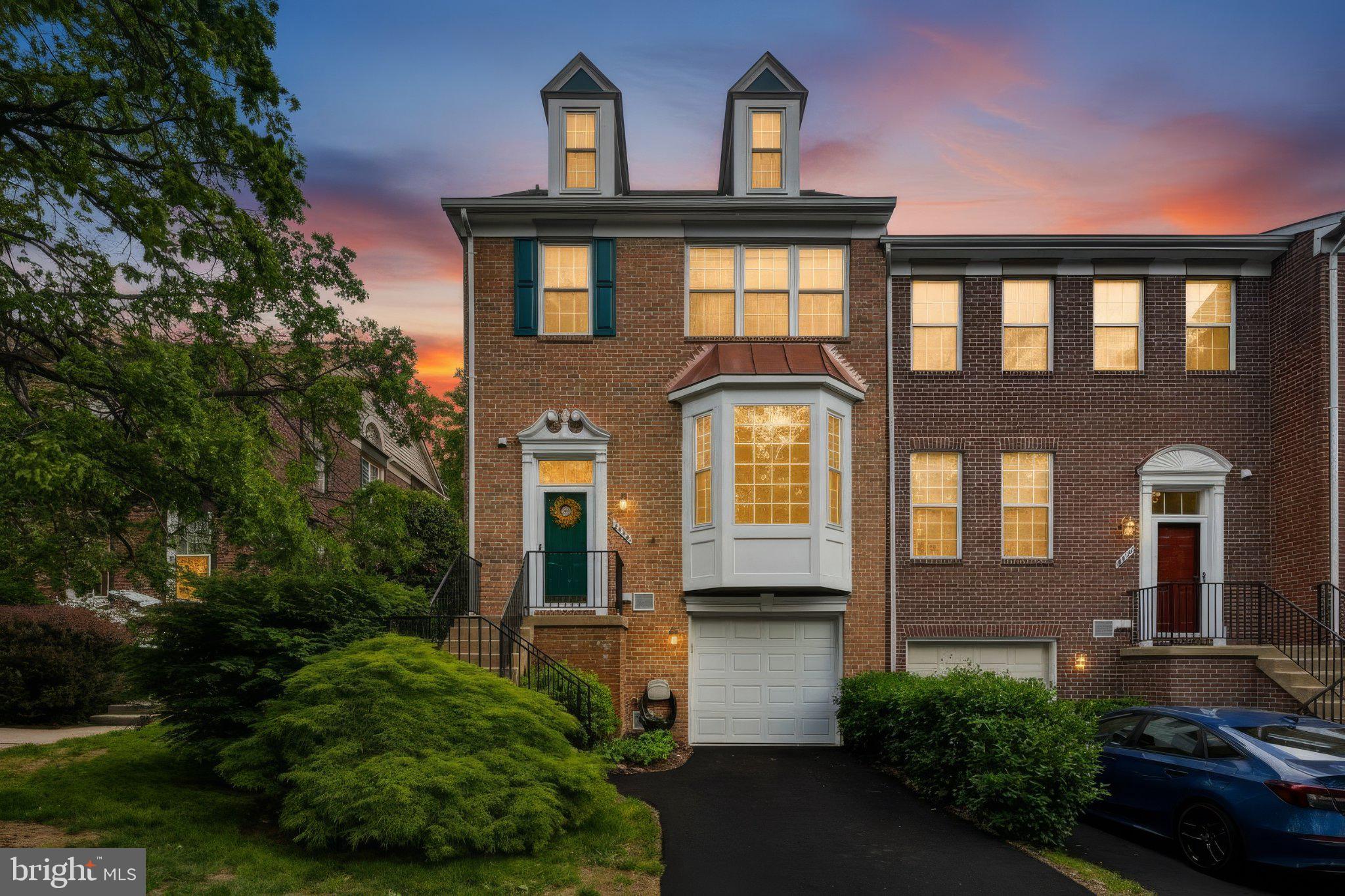 Charming brick home at sunset glow.