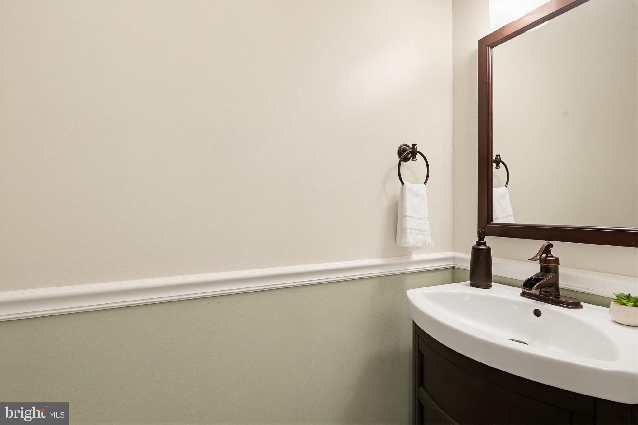 6516 Milva Lane Springfield, VA 22150 - Photo 11 of 35 Elegant half-bath with modern touches.