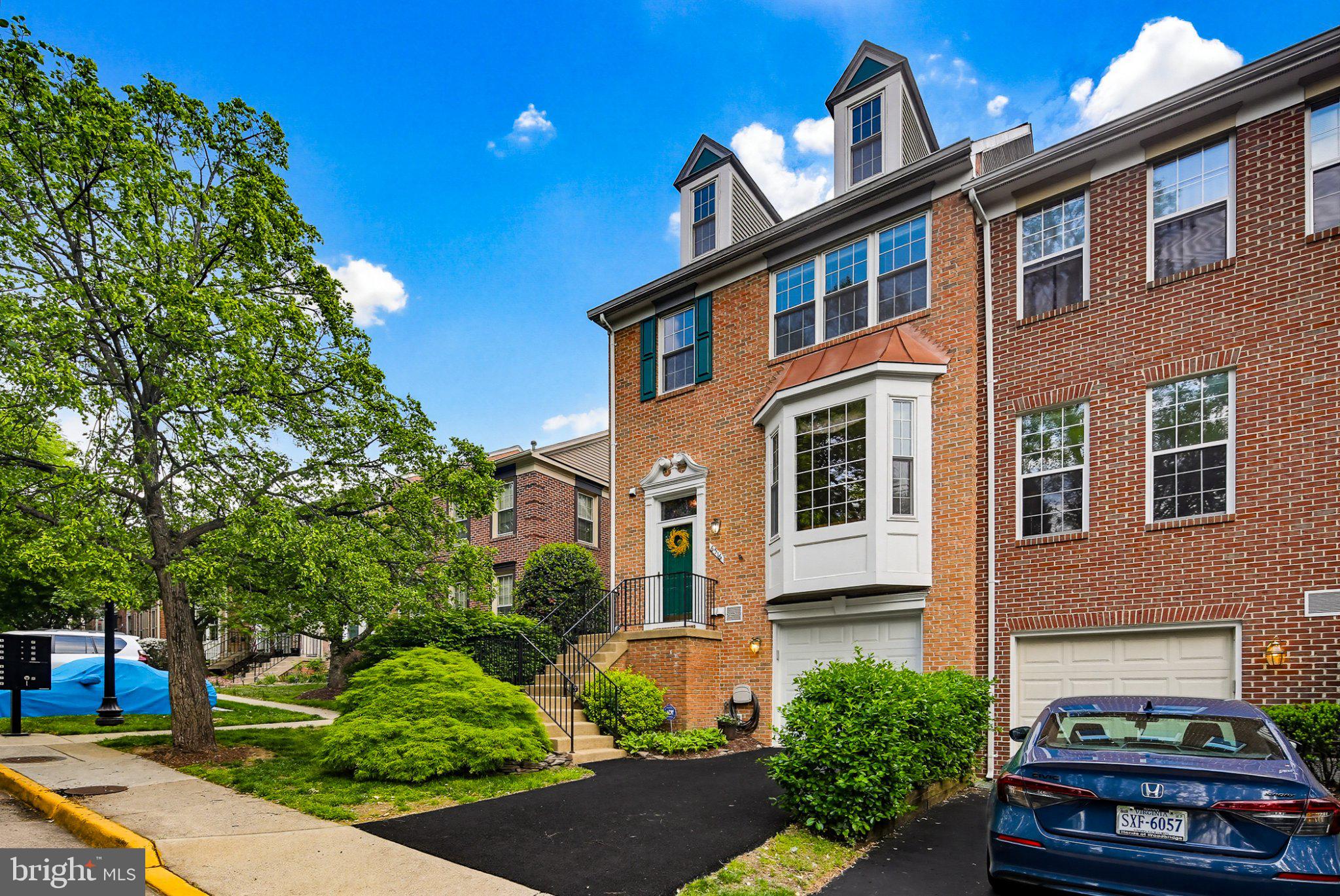 6516 Milva Lane Springfield, VA 22150 - Photo 2 of 35 Charming brick townhouse with greenery.