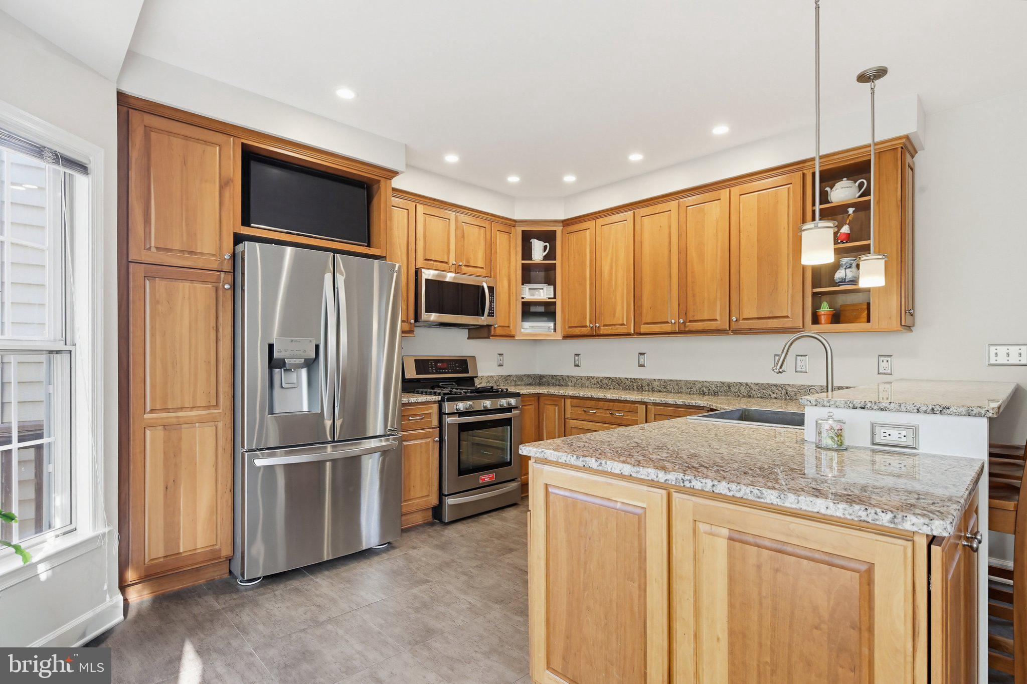 6516 Milva Lane Springfield, VA 22150 - Photo 3 of 35 Modern kitchen with warm wood tones.