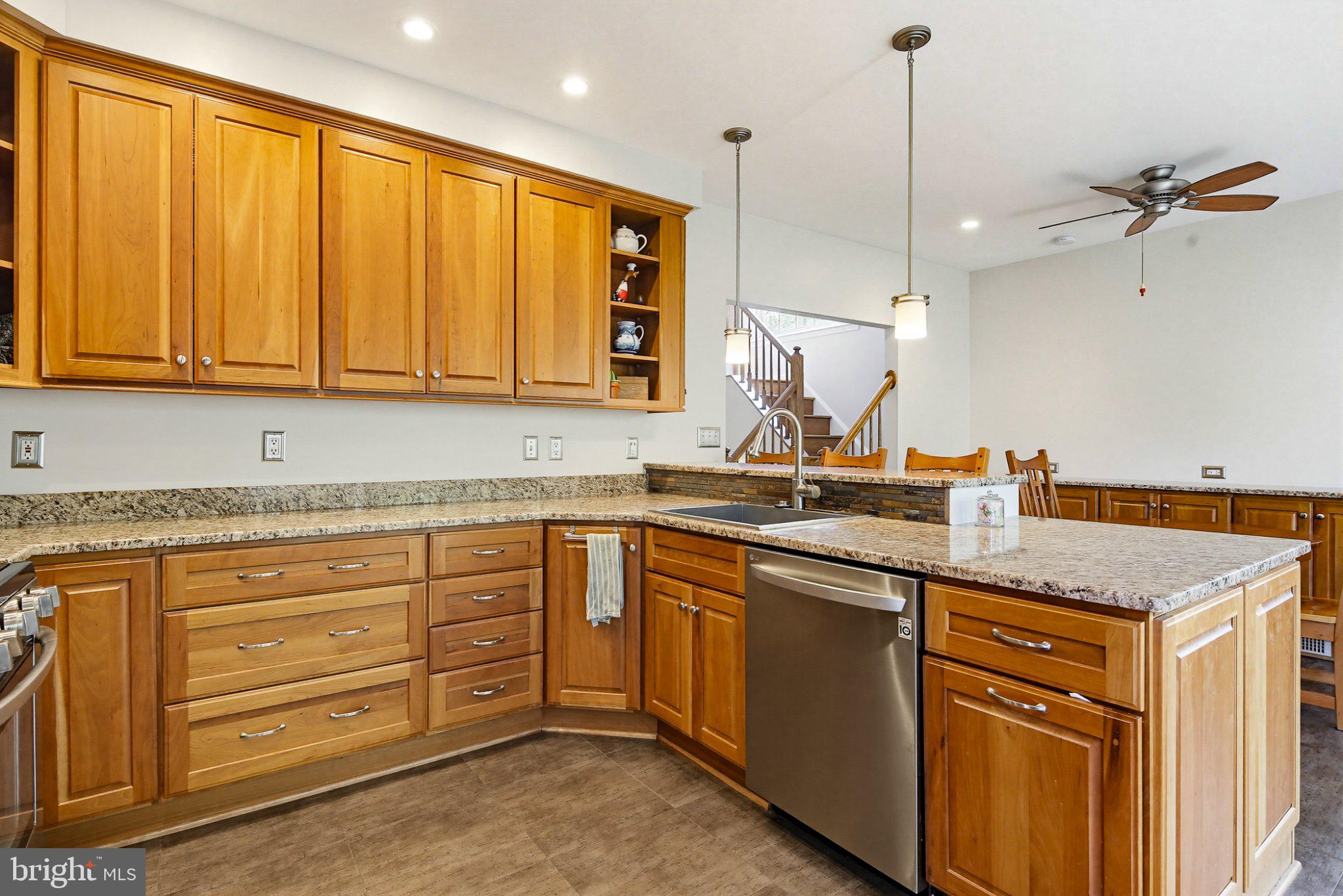 6516 Milva Lane Springfield, VA 22150 - Photo 4 of 35 Warm wood tones in a modern kitchen.