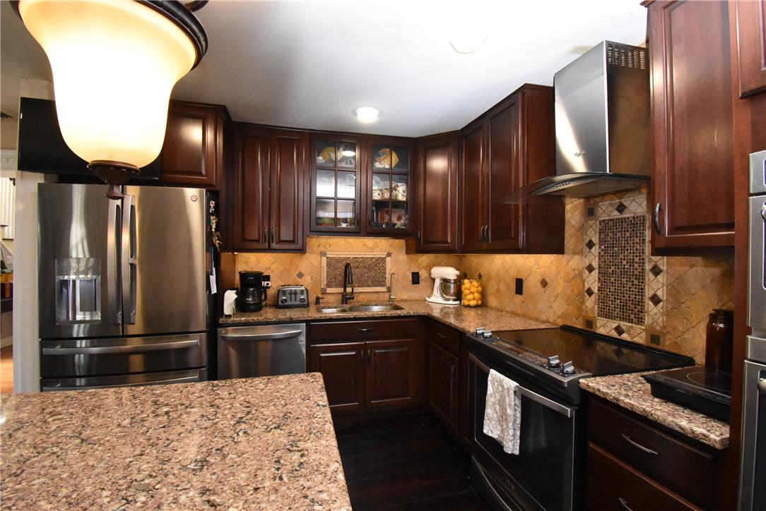 424 Grape Street Whitehall, PA 18052 - Photo 14 of 50 This spacious kitchen offers ample counter space and storage, perfect for culinary endeavors.