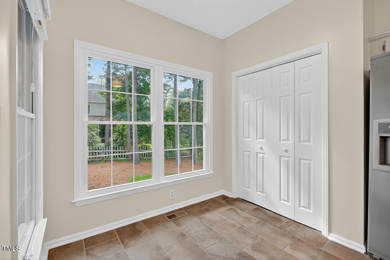 8825 Kirkstall Court Raleigh, NC 27615 - Photo 20 of 49 an empty room with windows