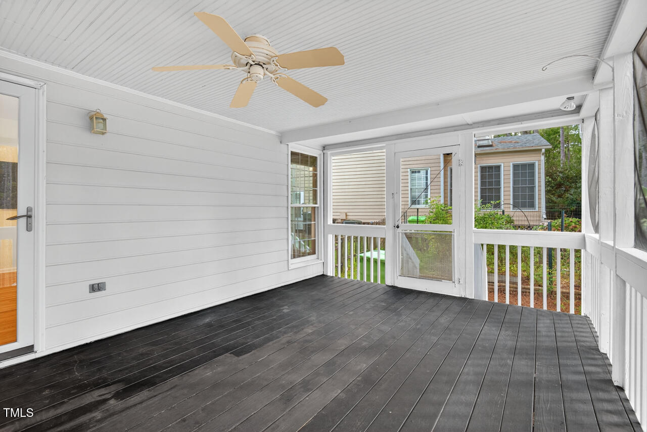 8825 Kirkstall Court Raleigh, NC 27615 - Photo 26 of 49 a view of a porch with wooden floor and fence