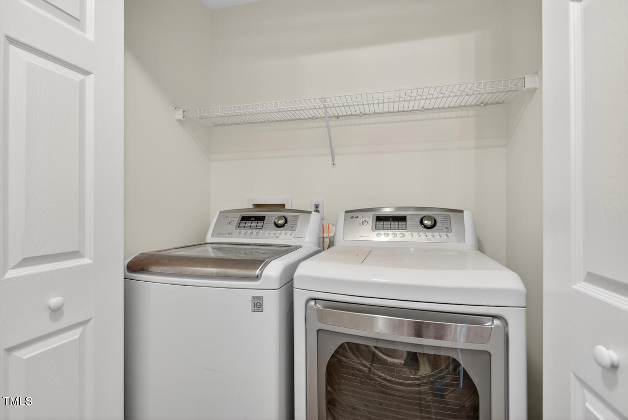 8825 Kirkstall Court Raleigh, NC 27615 - Photo 38 of 49 a utility room with dryer and washer