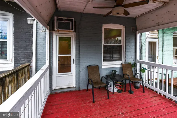 a view of a building with chairs and wooden floor