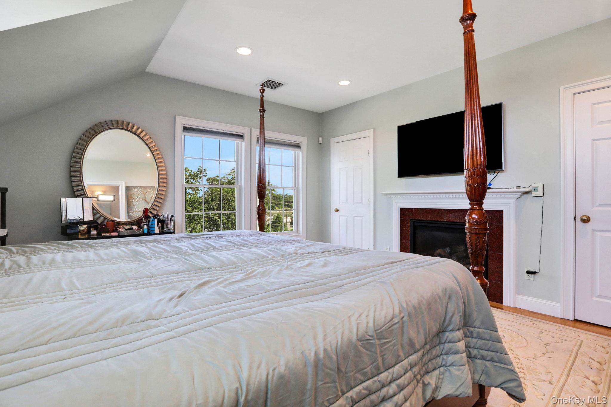 2 Harbor Lane, Unit 301 New Rochelle, NY 10805 - Photo 24 of 33 a bedroom with a bed and a flat screen tv