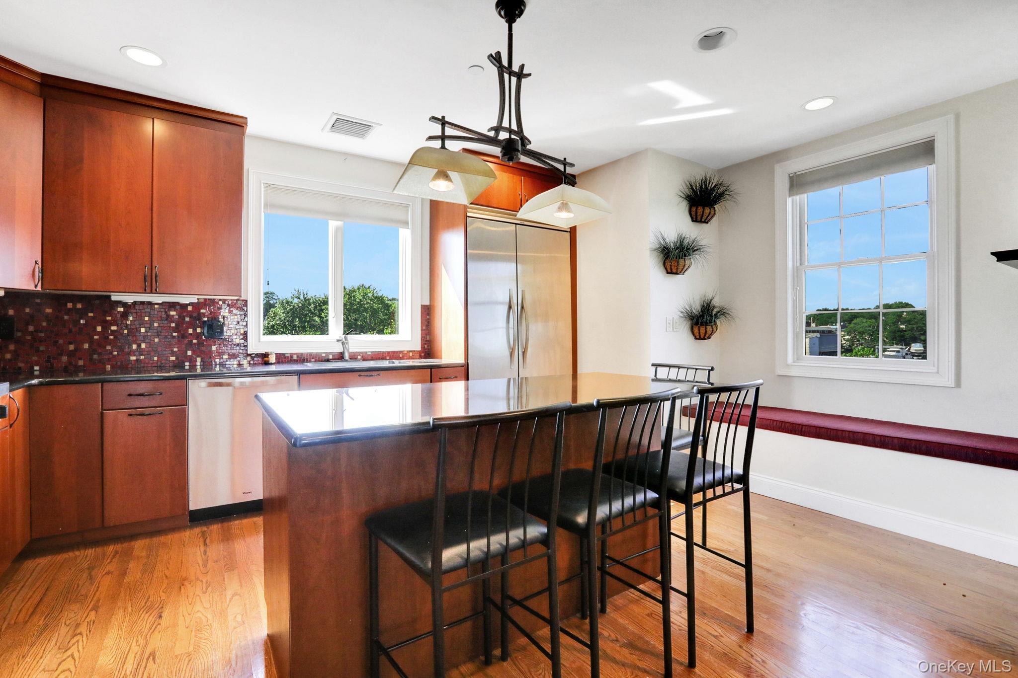 2 Harbor Lane, Unit 301 New Rochelle, NY 10805 - Photo 8 of 33 a view of a dining room with furniture window and outside view