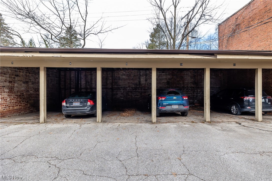 2473 Overlook Road, Unit 9 Cleveland, OH 44106 - Photo 21 of 22 View of parking featuring a carport #9 for one automobile.
