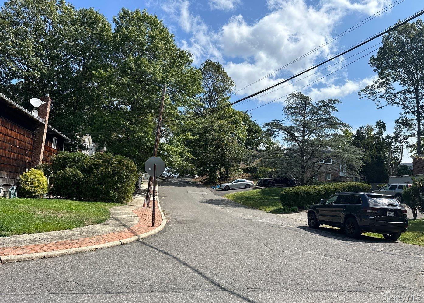 49 Lieper Street Huntington, NY 11746 - Photo 3 of 3 a car parked on the side of the road