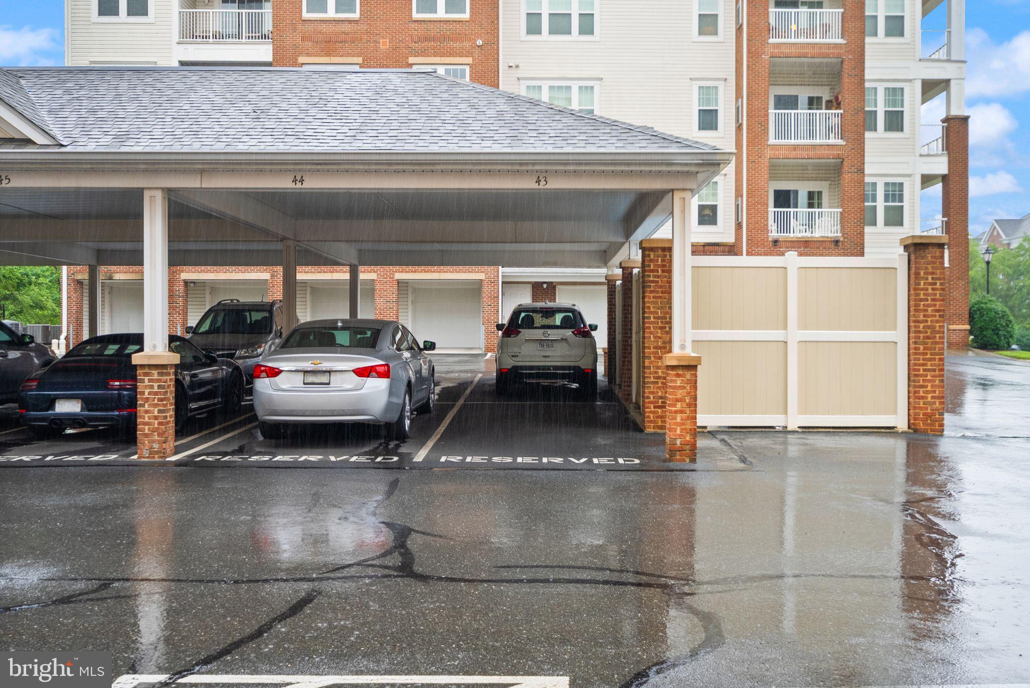 20610 Hope Spring Terrace, Unit 104 Ashburn, VA 20147 - Photo 24 of 38 Covered parking in a serene setting.