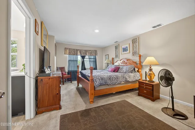 a bed room with a bed and a lamp