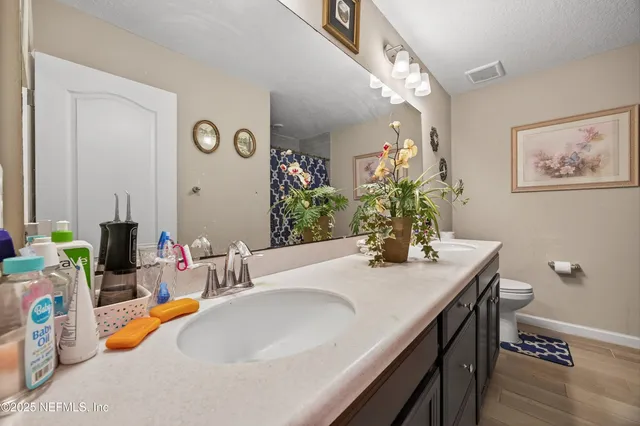 a dining room with furniture and a mirror