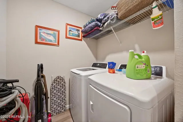 a utility room with dryer and washer