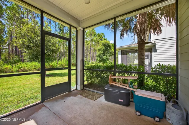 a room with furniture and a garden