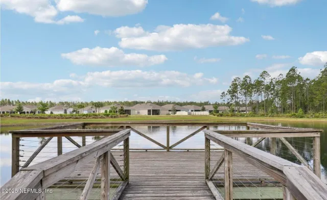 a view of trees and sky from balcony