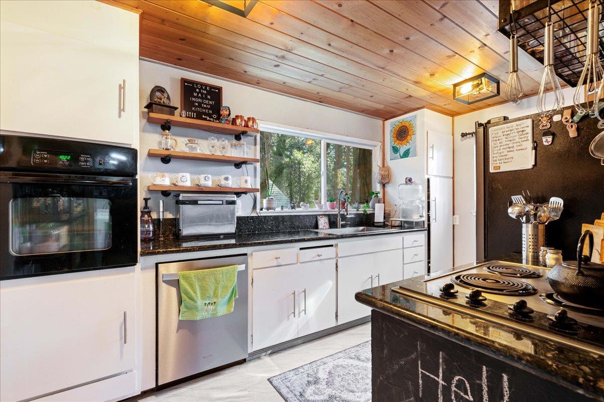 6780 Ridgeway Drive Pollock Pines, CA 95726 - Photo 6 of 27 a kitchen with stainless steel appliances granite countertop a stove and a sink
